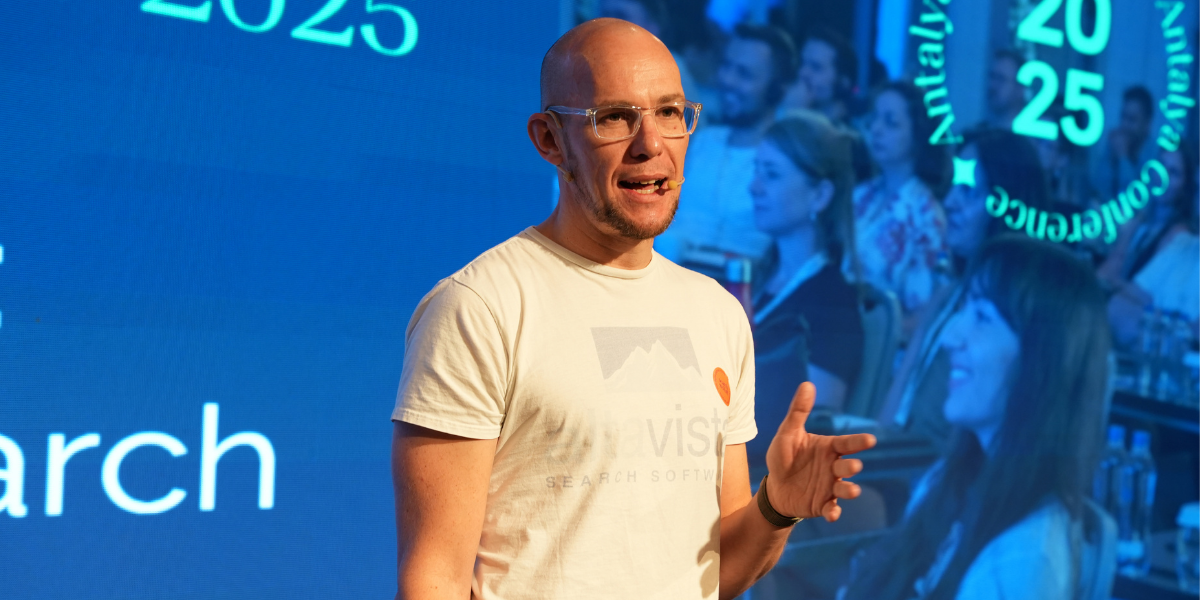 Mark Williams-Cook presenting “From RAG to Riches” on stage at SnS Antalya 2025 conference.