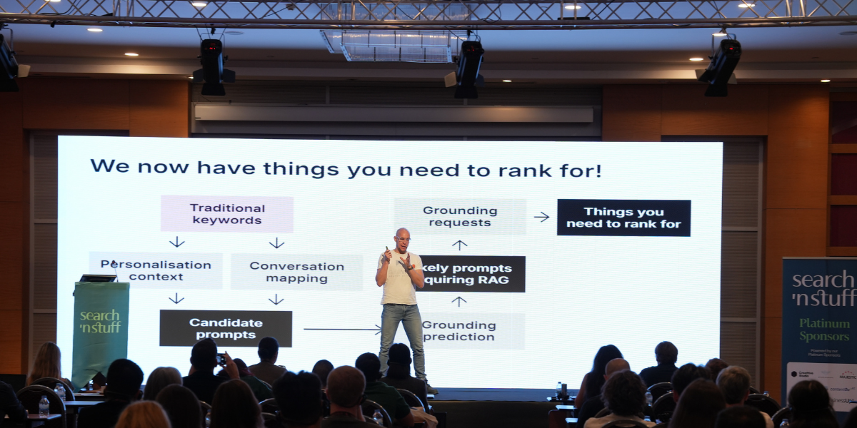 Mark Williams-Cook presenting “From RAG to Riches” on stage at SnS Antalya 2025 conference.