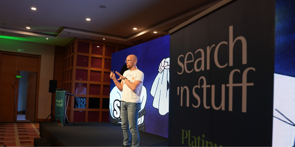 Mark Williams-Cook presenting “From RAG to Riches” on stage at SnS Antalya 2025 conference.